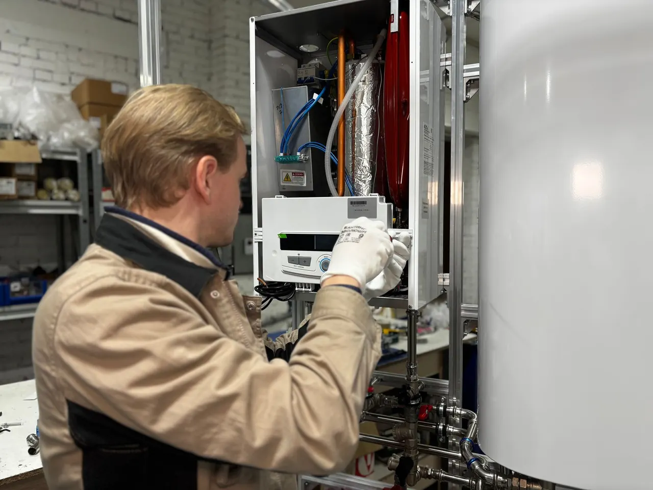 Technician working on a wall-mounted unit
